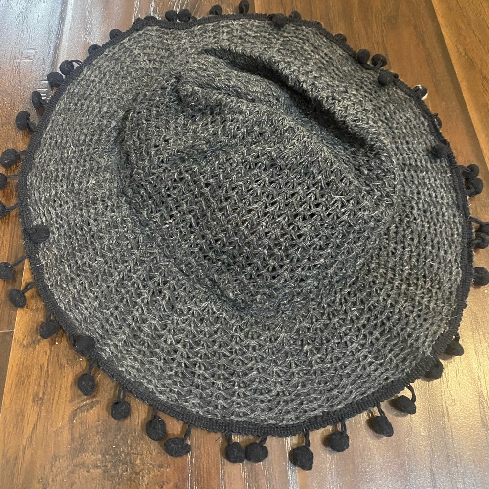 Black hat with tassels